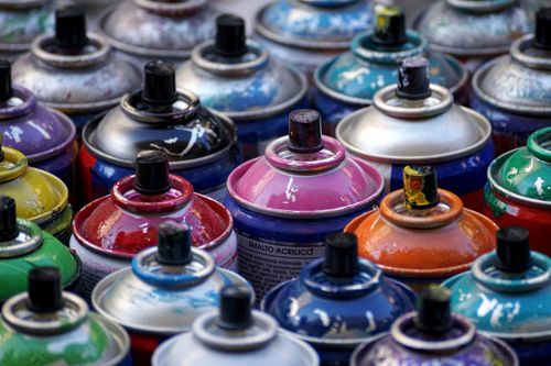 image of lots of different coloured spray cans